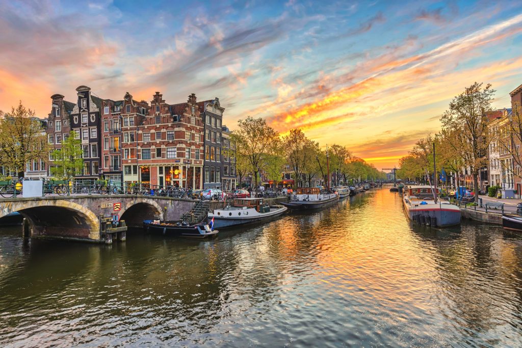 Amsterdam Sunset City Skyline At Canal Waterfront, Amsterdam, Netherlands